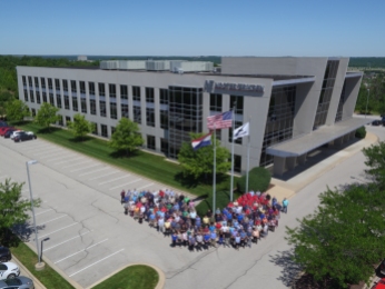 Here is a higher aerial image to showcase the building as well as the employees.