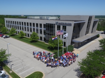 Here is a higher aerial image to showcase the building as well as the employees.